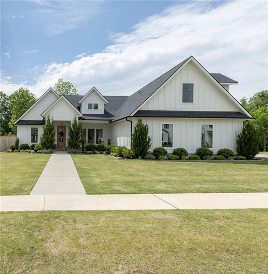 This beautiful custom home built by Austin Mayfield is a 4 BR. 3.5 bath located in East Fayetteville neighborhood, Blackberry Ridge has a country feel not far from town. Situated on a desirable corner lot, this stunning home features soaring vaulted ceilings, spacious living areas, and thoughtfully designed finishes throughout.  The well-landscaped yard and attractive privacy fence create a peaceful outdoor retreat perfect for relaxing or entertaining. Also septic is set off from the backyard so it could accomodate a private pool installation.  Combining elegance, comfort and curb appeal, this exceptional home offers luxury living in one of the area’s most desirable communities.