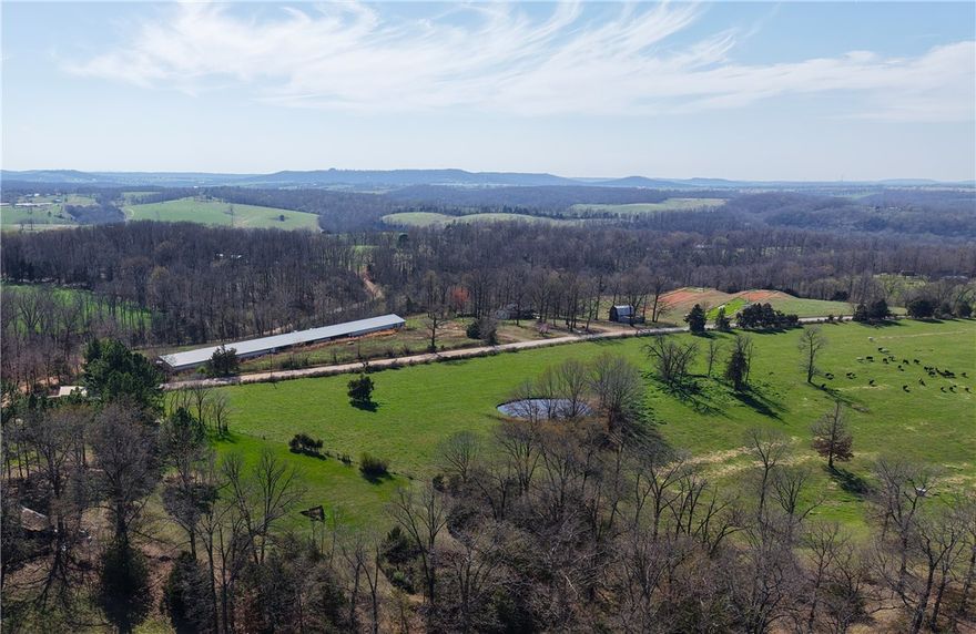 78.6 acres of fully cleared, usable land with a pond and CR 8520 frontage—ready for your vision. Rural water is available at the street, making development straightforward. The open terrain provides multiple exceptional building sites with ample room for a home, shop, livestock, or a larger ranch-style setup.

Located just 20 minutes from Springdale, this property offers the balance buyers are looking for—peaceful country living with a convenient commute to Northwest Arkansas’ major employers, shopping, and dining. You’re also a short drive to the Ozark Mountains, Buffalo National River, and endless outdoor recreation including hiking, fishing, and exploring.

Whether you're building a primary residence, creating a working property, or investing in land within a high-growth corridor, this is a strong opportunity with scale and flexibility.  MLS cross reference 1339342 and 1342099