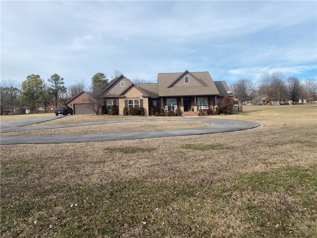 Welcome Home! This gorgeous 4 bedroom, 3 full bathroom and 2 half bathroom home sitting on a generous lot of 2.43 AC located right in the middle of town is ready for you. The spacious living area with it's vaulted ceiling and cozy fireplace is exactly what you've been dreaming of! The kitchen is a chef's dream with the pot tap, Electric oven, gas cooktop, abundance of cabinet storage, a fabulous island and an walk-in pantry. Right off the kitchen you will find the primary suite where the bathroom features double sinks, a makeup vanity, marble walk-in shower, and a fantastic walk-in closet. In the beautiful back yard, you will find a Pergola with a built-in barbecue grill and a bar with seating, extra patio space including a screened in porch, and plenty of room for kids, a pool or for hosting friends or family. The 3 car + 2 car in the detached garage and professional landscaping add to the curb appeal. You don't want to miss this one!