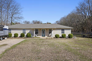 Discover this charming 5-bedroom, 2-bathroom home nestled on almost an acre of land, offering plenty of space for your family to enjoy. With 1,540 square feet, this inviting home features a functional layout designed for comfort and convenience. The cozy living area provides a welcoming space to relax, while the well-equipped kitchen makes meal prep a breeze. Each bedroom offers ample space, making it perfect for a growing family or those needing extra room for a home office or guest space.Outside, the large yard is ideal for outdoor activities, gardening, or simply enjoying the peaceful surroundings. Whether you're looking for a place to call home or a great investment opportunity, this property is a must-see! Don't miss your chance to own this charming family home with room to grow.