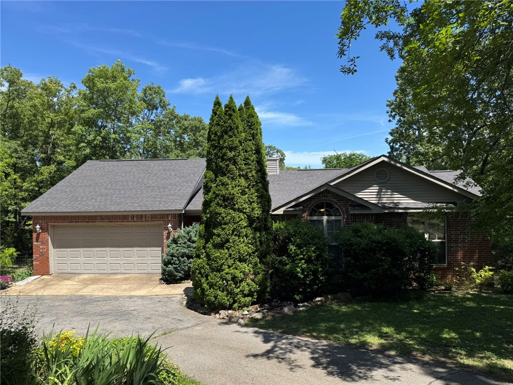 DISCOVER THIS PICTURE PERFECT 4 BEDROOM/2.5 BATH, RECENTLY UPDATED & WELL-MAINTAINED HOME SITTING ON A 2.5 AC/ML WOODED LOT, THAT FEATURES A FENCED IN BACK YARD, CIRCLE DRIVE, LARGE 16X27 TREX DECK, COVERED FRONT PORCH, LARGE MATURE TREES, A 18 X 20 STORAGE BUILDING WITH LOFT STORAGE. DO SOME YEAR-ROUND GARDENING IN THE NEW GREEN HOUSE. INSIDE YOU FIND A WELL-DESIGNED UPDATED KITCHEN, SPLIT BEDROOM PLAN, VAULTED CEILINGS, LARGE MASTER BEDROOM, WITH A WALK IN CLOSET. THE LIVING ROOM FEATURES A GAS LOG FIREPLACE. ENJOY THE RECENTLY INSTALLED SHAW LVP FLOORING THROUGH OUT THE HOME. THIS HOME IS LOCATED NOT FAR FROM BULL SHOALS LAKE ACCESS. IN A QUIET SUBDIVISION. DON’Y MISS YOUR CHANCE TO OWN THIS TASTEFULLY UPDATED HOME.