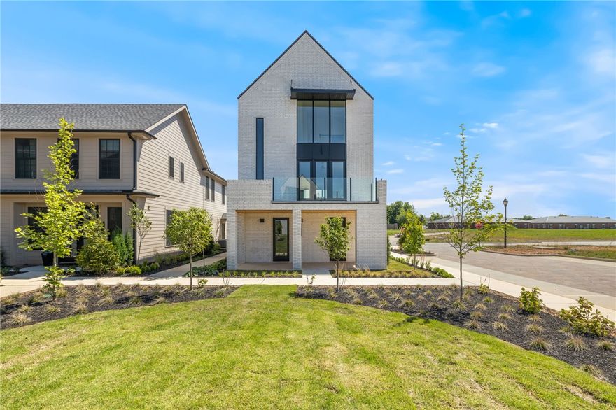 $4000 Preferred Lender Credit! This beautiful home sits in the heart of town, offering an unbeatable location and luxurious living. The new Pinnacle Village Development is just off of Pinnacle Hills Parkway, tucked behind the Walmart Neighborhood Market. Each unit showcases high-end finishes including hardwood floors, 10'ceilings, 8' interior doors, designer lighting and programable thermostat. The open kitchen features quartz counter tops and premium stainless-steel appliances with a gas range. An elevator provides easy access to every level. The bedroom on the bottom level offers complete privacy and can serve as a mother-in-law suite or guest suite. Complete with washer and dryer. The spacious 2-car garage includes an EV outlet. The home is also within walking distance to the Walmart AMP, Topgolf, restaurants, shopping, entertainment and more! Whether you're looking for a personal home or an investment property, this residence offers the best of both worlds.