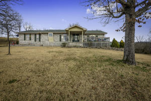 Follow your driveway into your privately set 4bd/3bath home that will be an oasis on 10.5 acres. The front picture window looks out onto a nice view and the back picture window looks onto the large above ground pool. Large spacious rooms throughout with a master suite which includes a large walk-in closet and master bath with separate tub and shower. The possible 4th bedroom would be in the basement with it's own bath and kitchenette. Only one-tenth of a mile of gravel road. Easy access to Hwy 65 South near the Buffalo National River. The pond on the property is a seasonal pond.