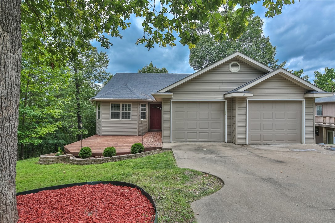 This home is a great opportunity to become a part of the Beaver Shores community. When you're not enjoying the massive downstairs bonus room or drinking your morning coffee on your private balcony, spend your time out on the lake! Enjoy quick Beaver Lake access while being secluded from busy lake traffic. This home provides the best of both worlds, take advantage of a secluded feel without being too far from the booming downtown Rogers area.