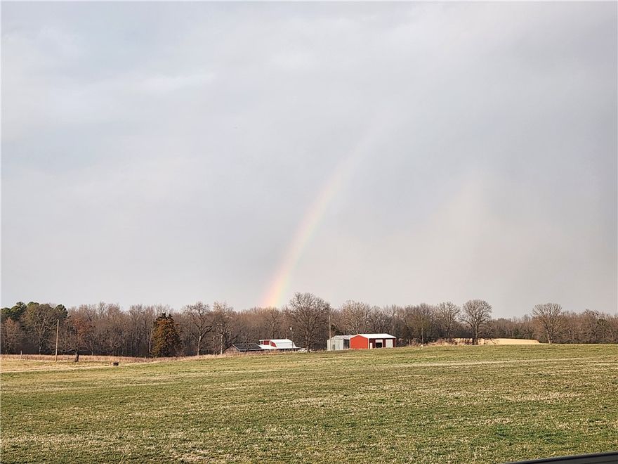 Take a look at this rustic 2 bed 2 bath home set on the bottom edge of Boone Counties' beautiful countryside.  This home has two primary suites, each with their own covered deck, and an open living space.  It also has two large shops, one original and one brand new.  Wake up to views that overlook a beautiful, lush field to the South and your own stocked pond to the North. This 4.5 acres is fully fenced and livestock ready.   Enjoy the benefits of solar assisted electric and see if this country home is right for you.  Setup your showing today!
