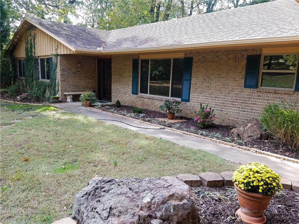 Your family will be pleased because this home has privacy yet super convenient to everything. Nearly 2500 sf on 2+ acres in the city limits is hard to find! Recently painted interior, new windows just installed in the main structure of the home. Updated kitchen with new countertops, cabinets & appliances. Home has 2 1/2 baths, large attached carport, lots of hardwoods on the acreage & a shop in back. The deck overlooks the private backyard for your enjoyment. Call today for your showing!