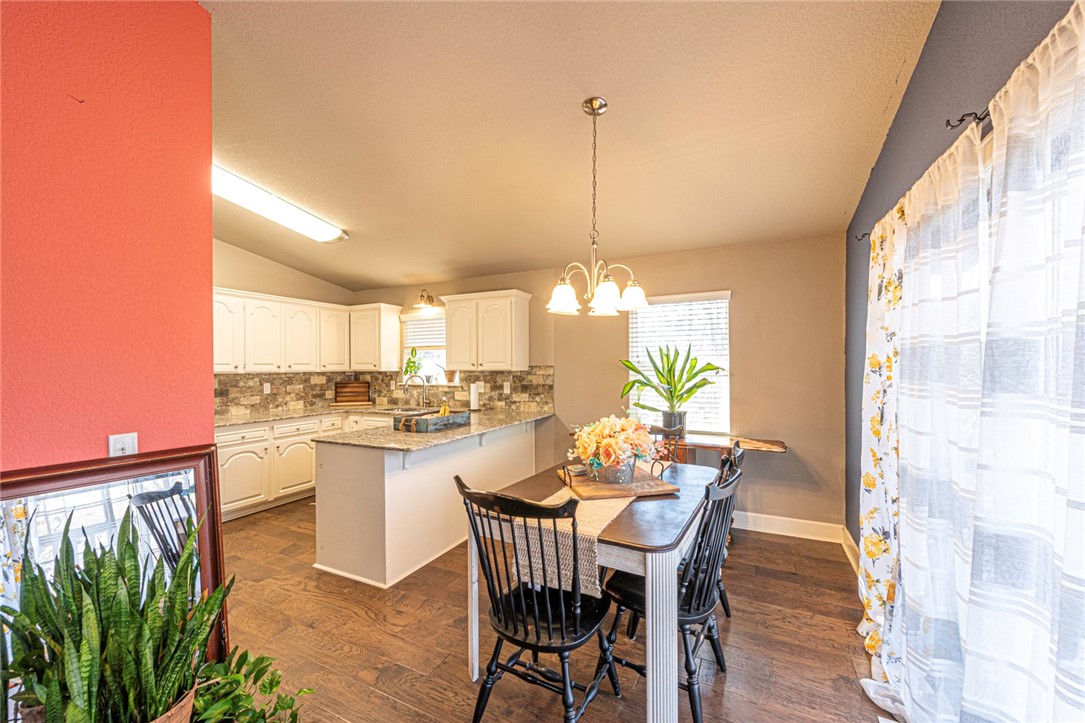 WELCOME! This charming 3 bedroom 1.5 bath home originally constructed in 1973 was updated in 2017 by previous owners and is the perfect place to call home! Inside a spacious living room with laminate wood floors, vaulted ceiling and lots of natural light! Flow into the eat-in dining with large kitchen featuring white cabinetry, granite counters, stainless steel appliances, and counter peninsula with room for additional seating! Plus spacious bedrooms with wood laminate throughout! The main bathroom features granite counters, tub with tile shower! Out back enjoy a partially covered deck overlooking the hillside! Need some more storage? Basement storage is available! Located minutes away from Lake Norwood! This home would be perfect for investors and first time home buyers alike! Act now!