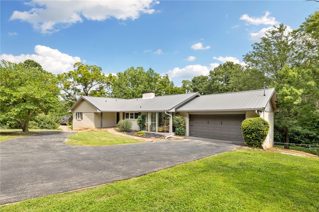 Welcome to this beautifully designed 5-bedroom, 3-bath home perfectly situated in the heart of Fayetteville. Just a short walk or bike ride to Gregory Park with its wooded trails, bike skills course, and open green spaces, and minutes from the University of Arkansas, downtown Fayetteville, shopping, dining, and entertainment, this location offers the best of city convenience with a neighborhood feel.
Inside, you’ll find a spacious living area ideal for gathering, a well-appointed kitchen with abundant storage and prep space, and a flexible layout to suit a variety of lifestyles. Step outside to enjoy a private backyard retreat, perfect for relaxing or entertaining.
An active short-term rental (STR) license conveys to the new owner with City of Fayetteville approval, offering an excellent opportunity for investment.
Move-in ready and thoughtfully maintained, this home combines space, comfort, and an unbeatable central location — a rare find in one of Fayetteville’s most connected and desirable areas.