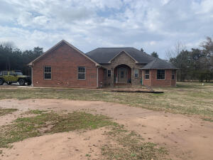 Immaculate Brick and stone home with over 4.5 acres on scenic 7. Granite counter tops, hickory cabinets, ceramic tile and hardwood flooring throughout. 3 Bd 2.5 BA with split floor plan. Energy efficient with low electric bills. Wide exterior and interior doors and taller toilets for handicapped accessibility. Oversized 2 car garage, a dually fits on either side of it. with a shop. This is a must see.