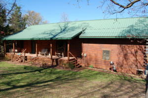 Looking for that perfect Log Home on the Lake? Check out this beautiful Home beaming with Rustic Charm. When you step through the door, the pride and craftsmanship built into this home is evident! Low utilities, easy to heat and cool...there is just SO much to enjoy....OPEN floor plan, screened in porch overlooking Bull Shoals Lake. LARGE finished walkout basement with Two large windows to let in tons of light! Marina's and Golf course in one small town. Peaceful, paved roads, WONDERFUL neighbors.....This is your perfect Lake Home or Summer getaway!