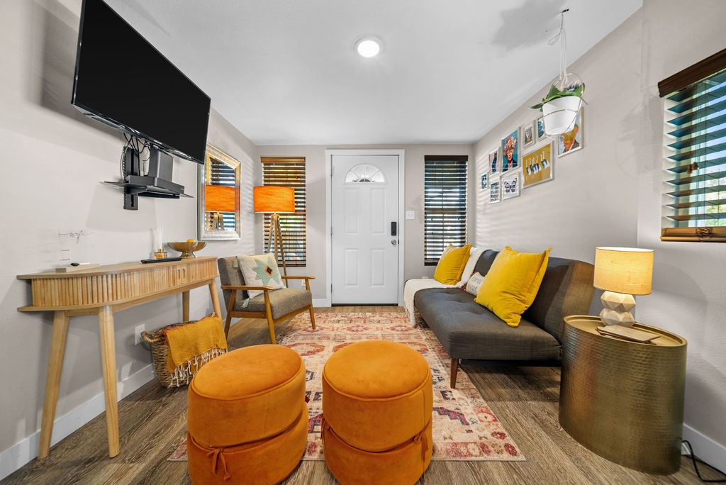 Welcome to the Tiny Tangerine, a charming 1-bed, 1-bath tiny home in the heart of downtown Rogers! Bursting with personality, this cozy retreat features delightful tangerine-themed details throughout. Currently a thriving short-term rental, it’s a fantastic investment or the perfect private getaway. Designed for both comfort and efficiency, it offers stylish finishes, a functional kitchen, and a warm, inviting atmosphere. Tucked away for privacy, the home is accessed from the alley behind the property. Just minutes from downtown shops, dining, and entertainment, the Tiny Tangerine is a one-of-a-kind gem!