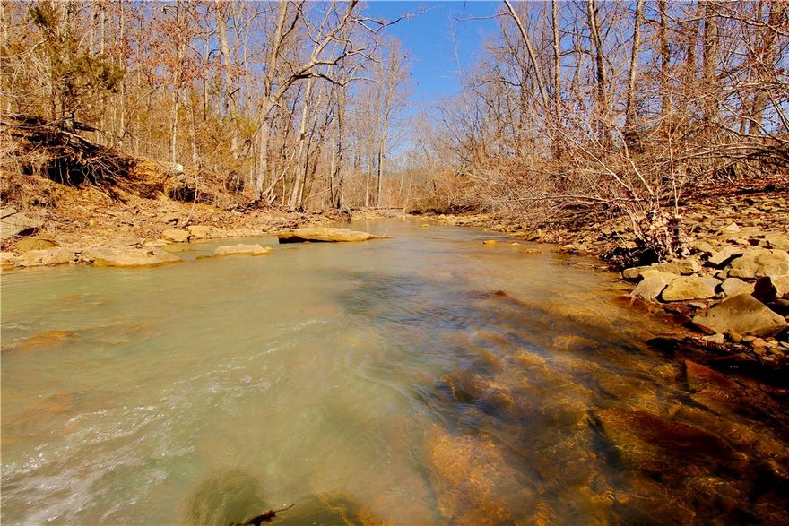 12.93+/- Acres with Kecks Creek frontage and county road frontage. Property consists of all pasture,  some timber and some fencing.