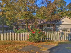 This wonderful small-town home is set in a cul-de-sac on over half an acre! You'll love having coffee on the covered back deck or cooking in the spacious kitchen with beautiful granite countertops! There is a wonderful and unique jetted tub to relax your cares away in the master bathroom. There is plenty of room for storage with extra space in the laundry room, the 10x10 outbuilding, and carport. The garage has been renovated and can fit 2 cars comfortably. Come see this charming home that is just off the beaten path!