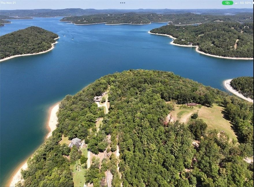 Beautiful waterfront home on Beaver Lake w/ 382’ of shoreline. 250’ feet to water’s edge.
Optional 10’x26’ boat slip for additional monies (possible owner financing). 1600 SF red iron
building, insulated, wood heat, electric doors, 100-amp service. Home was completely
reconfigured/remodeled in 2017, w/ 1000+ SF added. Every room has a view of Beaver Lake
(excluding the upstairs bathroom). Custom stairs, kitchen bar, and forced air wood burning
fireplace. Large 330 SF primary bedroom and 264 SF primary bath w/ jetted tub, custom 22 SF
shower w/ rain head and 8 jets, 2 vanities, 2 walk-in closets, and separate toilet room. Luxury
vinyl and tile throughout. All windows are Anderson double hung tilt-in. Kitchen has
LG appliance suite, soft close drawers/cabinets. Large 63 SF laundry room. Office could be
converted to third bedroom. Two HVAC units. New water heater/water softener. 225 SF front
porch, 400 SF carport, 825 SF deck. 210 SF walk-out basement is a bonus room
remodeled 2025.7 min drive to dock.