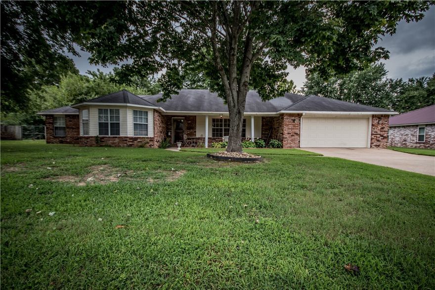 Great, spacious 3 bedroom 2 bath home for lease in Rogers. Home features: spacious kitchen/eating area, wood floors, large fenced backyard, covered front patio and a bonus room that could be a great office/gym/ or man cave. Also includes TANKLESS WATER HEATER & keyless entry!!!! Close to shopping and schools! Come see it today! Lawn care is provided by the owner of the property during mowing season!!!