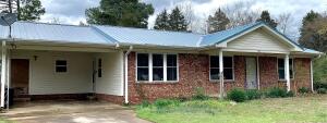NEW PRICE!! Conveniently located on a dead-end street, so no through-traffic. Just far enough from Exit 57 for peace and quiet, but close enough to make travel to any part of Clarksville a five-minute or less drive. Solid brick home with three spacious bedrooms; two bathrooms. Brand new flooring in dining room, kitchen, and laundry/sun room! Large front and back yards! One vehicle carport is extra wide, and has a storage room.