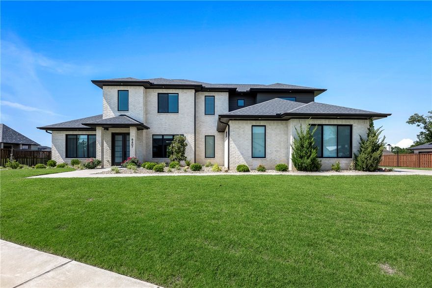 This Stunning 5 Bed, 5 1/2 Bath home in the Estates of Scissortail,blends high quality and sophistication into a Modern Design & Effortless Living.The chef’s kitchen,living room and patio open up to a flat and huge backyard giving you the balance between retreat and coziness.Designed for entertaining and daily enjoyment the versatile and gourmet kitchen offers professional high-end appliances with quartz island. The primary bedroom has a huge walk-in closet and a spa-inspired bathroom featuring a soaking tub and a huge walk-in shower to make this your retreat.A Jr-suite on main floor and bonus room with access to the outdoor patio make this house a place to captivate and enjoy your family and friends. Upstairs you find 3 ensuite bedrooms with walk-in closets, making this home perfect for guests, teens or kids. You will experience the privacy and security of the Scissortail gated community and be minutes away from top rated Bentonville schools.Back on market at no fault of seller or home.Schedule your showing today.