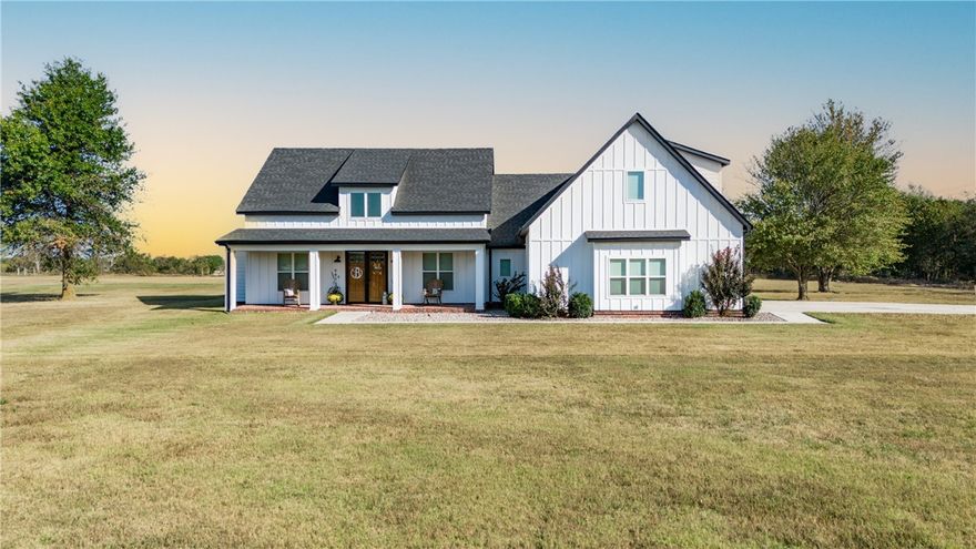 Discover the perfect blend of country living and modern convenience. This stunning 2021-built modern farmhouse sits on a generous 3.7-ac lot, offering the space and privacy you've been dreaming of while keeping you in Bentonville School District. With 3,290 sqft of thoughtfully designed living space, this home features soaring cathedral ceilings, a split floor plan, and luxurious finishes including luxury vinyl plank flooring and custom built-ins. The heart of the home showcases a gourmet kitchen with propane cooktop, while the bonus room upstairs provides endless possibilities. Step outside to your private retreat featuring a covered patio overlooking your in-ground pool—perfect for entertaining or unwinding. The 3-car attached garage and level, cleared lot provide plenty of room for toys or hobbies. Don't miss this rare opportunity to own a nearly-new modern farmhouse with resort-style amenities.