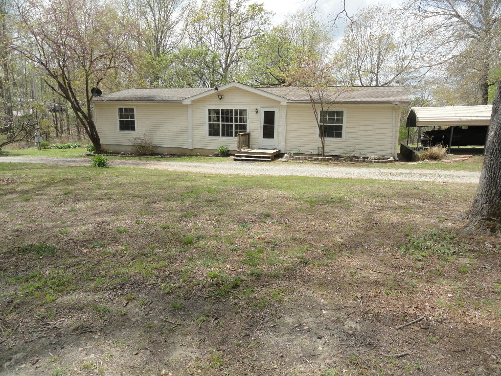 Move-in ready, immaculate & well-kept 3 bed 2 bath doublewide mobile home with paved road frontage. This 1568 sq foot home is sitting on 1 acre M/L with a 16' x 16' storage building. The home has several extra features not seen in most mobile homes such as being constructed with 2x6 walls and double pane vinyl windows throughout which makes it easier to heat and cool. Also, each bathroom has its own double pane vinyl window skylight which allows natural sunlight into the room during the day. New vinyl plank flooring has just been installed throughout as well. New HVAC installed in 2022 and new roof 6 years ago. The water supply is a 400' deep well producing 22 GPM. Less than 2 miles to Walmart Super Center, restaurants & shopping & Baxter Regional Hospital only 5 miles away.