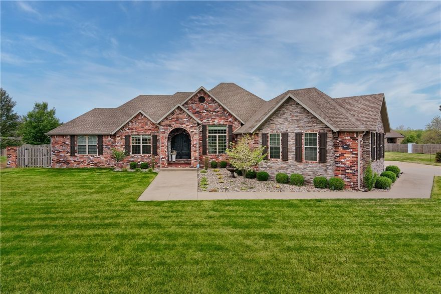 Welcome to this stunning 4 bedroom, 4.5 bath home located on over 1 acre of beautifully landscaped land.  The spacious kitchen boasts double ovens, gas stovetop, granite countertops, and an expansive island. A comfortable hearth room with a second fireplace is situated just off the kitchen. The primary suite offers a luxurious escape with a large walk-in closet, spa-like bathroom, and direct access to the utility room. The three additional bedrooms on this level are spacious and feature ensuite bathrooms. On the second floor, the bonus room can be used as an office, a study, or a fifth bedroom. Step out into the outdoor oasis and take in the stunning views of the beautifully landscaped yard, including a pool and hot tub spa surrounded by a sun deck. This home features an abundance of storage, including plenty of closets throughout. The three-car garage is oversized, with room for storage or a workspace. Located in a highly desirable area, this home offers the perfect combination of luxury, space, and privacy.