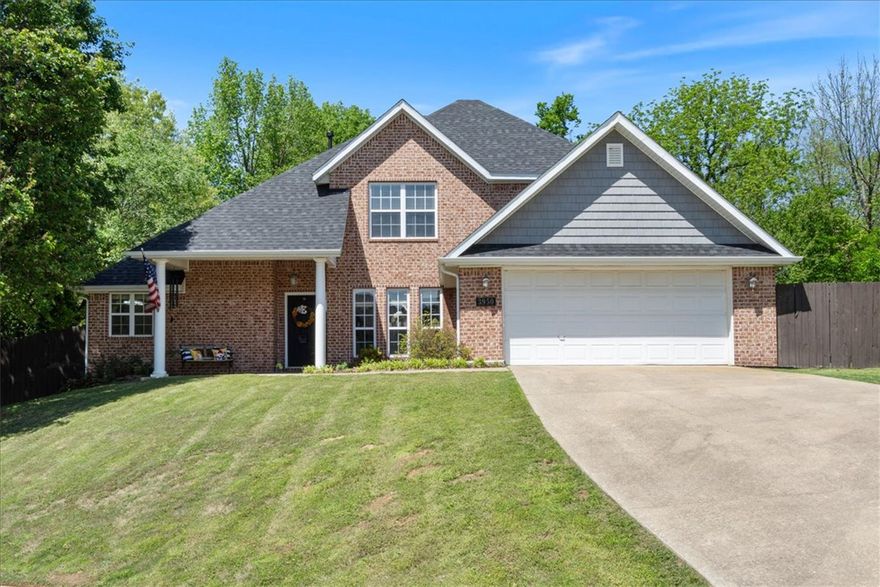 Introducing this charming two-story brick home nestled on a peaceful cul-de-sac, just a stone's throw away from Springdale Country Club, Lake Fayetteville, Pizzeria Ruby, & Wright's BBQ. Conveniently just minutes away from HWY I-49, this residence offers both tranquility & accessibility. Featuring 4 beds & 2.5 baths, this home sits on an expansive 0.65-acre lot enclosed by a fenced yard, providing privacy & security. The kitchen is generously spacious, boasting ample storage for all your culinary needs. Enjoy the airy ambiance of the living room w/ cathedral ceilings. The primary BR is a retreat in itself, offering a large space & an en-suite that includes dual sinks, sitting vanity area for makeup, and a luxurious soaking tub. The thoughtful upgrades to this home include a new roof in and a new 700 square feet screened in deck with a outdoor kitchen in 2025. New flooring in 2026 and new carpet in 2024. Beautifully landscaped. Don't miss the opportunity to call this meticulously maintained residence your new home!