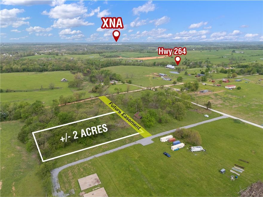 +/- 2 acres of land available just outside city limits, offering the perfect opportunity to build your dream
home and enjoy peaceful country living. This prime location is less than 9 minutes from XNA, only 5
minutes from The Creeks Golf Course, and situated just a half mile from Highway 264, providing
convenient access to nearby amenities. Located within the highly sought-after Bentonville School District,
this property combines rural charm with top-tier educational opportunities. Electric service is available at
the street, while a septic system and water well will be needed. A future easement to be added for easy
access to the property.