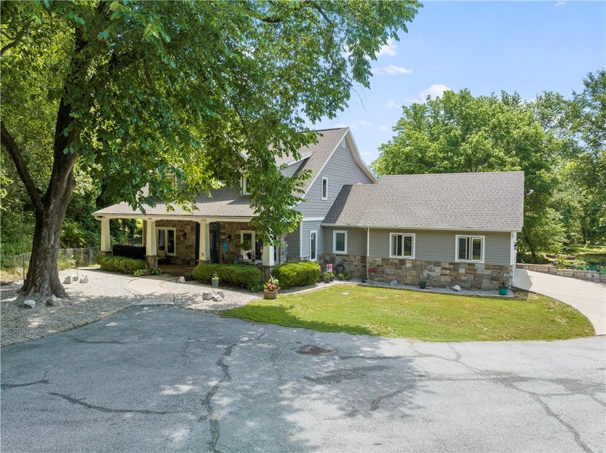 Private oasis only 7 minutes to downtown Gravette, 6 minutes to interstate 49 & nestled between mature trees with an amazing deck that overlooks two spring fed ponds. The home’s 4 bedrooms and 3.5 baths lend a perfect amount of space for the family! Beautiful detail, openness, soaring ceilings with ample windows to enjoy the beauty outside, make the home cozy and timeless. Ready to start your own mini farm? This is the perfect opportunity. The seller has added a Yoderbuilt Greenhouse to the property with electric to it and added electric to the 36x24 remodeled shop, finished out on one side w/sheetrock & trim making a great additional space for hanging out and having fun. Improvements include freshly painted interior and fences, new shop doors, 12x24 Barefoot Spa Hot Tub installed, new HVAC installed 6/2021, new garage door systems, chimney cap cleaned & resealed, shop remodel with Tyvek moisture barrier added & a new water heater 2022.
This home, land, shop, and greenhouse are waiting for you to enjoy!