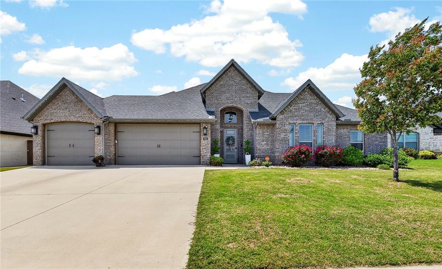 Beautifully maintained 5-bedroom, 3.5-bath home located in the desirable Bequette Farms subdivision within the Bentonville School District. Built in 2020, this move-in ready home offers 2,856 SF of functional living space with a popular split floor plan and thoughtful details throughout. The open-concept layout features a spacious living room with a cozy gas log fireplace and abundant natural light. The kitchen includes granite countertops, gas cooktop, convection oven, pantry, eat-in dining area, and ample cabinet space for everyday living and entertaining. The private primary suite features a spacious bath and oversized walk-in closet. Additional highlights include luxury vinyl plank flooring, built-ins, central vacuum system, attic storage, sprinkler system, security system, and a 3-car garage. Enjoy the covered patio and fenced backyard ideal for relaxing or hosting guests. Conveniently located near schools, shopping, dining, parks, and quick access to Bentonville and XNA.
