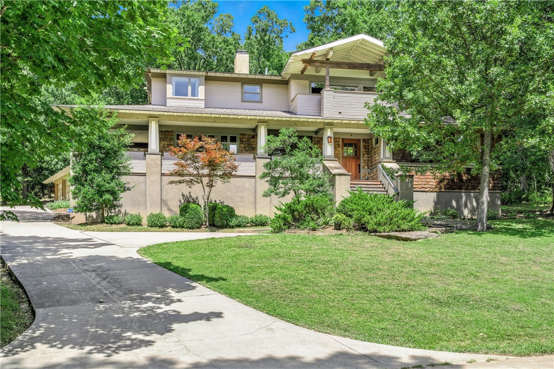 Rare opportunity! Enjoy peaceful living on an exclusive private drive on Mt. Sequoyah in a custom cedar craftsman by DEMX Architects. Access to Sequoyah Preserve and minutes to downtown. Entertain with an unparalleled layout with hickory hardwood floors, endless storage in maple and walnut cabinetry and teak decks. Chef's kitchen, butlerās pantry and walk-in pantry. Living room features wet bar with roll-out bar and gas fireplace. Dining room shares dual sided fireplace with library. Secluded fieldstone patio and gas fire pit in back. Primary suite has dual oversized walk-in closets, large luxurious jetted tub, and glass walk-in shower with dual shower heads. Upstairs, enjoy another living room, 3 bedrooms w/ walk-in closets, 2 full bathrooms and teak balcony with seasonal views. Whole home humidity control, efficient fresh air ventilators: ERVs. New heat pump water heater with instant backups. Up and downstairs laundry. Temp and humidity-controlled garage easily fits XL vehicles: +/-875 sqft not in listing.