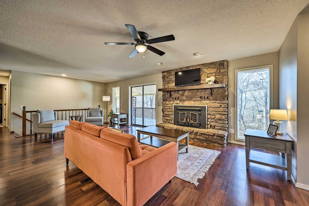 Spacious & family-friendly 4-bed, 3-bath home on a prime corner lot! With 3,090 sq. ft., this comfortable, well maintained gem boasts a fully finished walkout basement, featuring a private-entrance primary suite. Upstairs, enjoy a cozy wood-burning fireplace, a lovely covered deck accessible from the main-floor primary suite & living room. Outside is a treehouse that stays! All bedrooms have walk-in closets. Recent upgrades (2-1/2 yrs) include a new roof, flooring, paint, hot water heater, & light fixtures. Mountain bike trail access is just steps (or pedals!) away, with a garage outfitted to store 10 bikes & gear! Parallel parking space added along the front yard inside the property line. Cabinets in garage and downstairs closet do not convey.