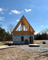 New build! 800sqft tiny home on 15 acres! The bedroom is upstairs and will have a deck off the back for those big mountain views! The full bathroom will be on the main level along with the kitchen, living and dining combo. This perfect location is just minutes to Bull Shoals Lake, Branson and Harrison! Construction is expected to be complete in May 2023. The home will have oak cabinets in the kitchen, tongue and groove pine wood ceiling, a metal roof, vinyl plank flooring throughout, washer/dryer hookups, shower, toilet, sink/vanity. Mini split system for heat and air will be installed. Septic has been installed. The 15 acres is fenced on 3 sides.
