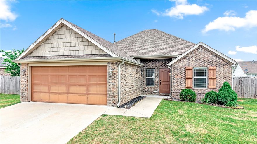 Hey, you have to check out this place! 1280 General McCrae Dr in Prairie Grove is such a great find — a solid brick home in the Sundowner neighborhood. We're talking 3 bedrooms, 2 baths, and 1,210 square feet built in 2016, so everything is still nice and newer. Inside, the vaulted ceilings make it feel so open, and the granite counters in the kitchen? Gorgeous. There's even a gas fireplace in the living room for those chilly Arkansas evenings. The walk-in closets are a total bonus, and the patio out back is perfect for hanging out on weekends. You get a 2-car garage, a quarter-acre lot, and get this — even a little storage shed! Honestly, whether you're looking for your next home or a smart investment property, this one is hard to beat. Come see it before someone else snatches it up!