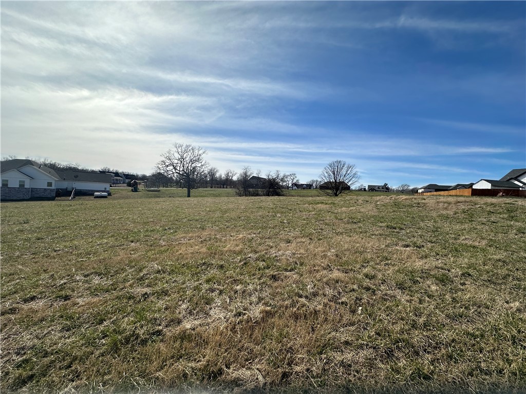 Come view this beautiful buildable lot that is ready for a custom "Build to Suit" home with local Custom Home Builder! This nice, peaceful and quiet subdivision has large lots to spread out, yet still with a friendly community vibe! Country feel but only minutes from Bentonville. Don't miss out on this one!