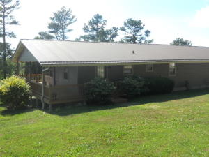 5BR 2BA home with over 2,100 sq ft, on 10.90 acres, joins the Ozark National Forest, large covered porch, 2 large decks to enjoy the breath taking views. 30 x50 shop building with 3 garage doors, home has metal roof, newer windows, hardwood flooring, large master bedroom with double walk in closets. Great home with a lot to offer, just a short distance off paved road.