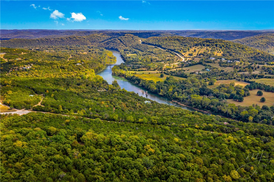 Less than 15 mins from historic Eureka Springs, make your great escape to the Ozark Mountains! Incredible views of the White River from this 1900sqft 3bed/2bath with 4 car garage and workshop on almost 5 acres less than 5 mins to Beaver Lake and all the areas festivities! Two large covered decks/patios, lush woodlands and garden space, with additional home-build site. Circular driveway and private entrance gate for ease of access and extra security. See attachments for extras list, SPD and aerial/plat info. Schedule your showing today!