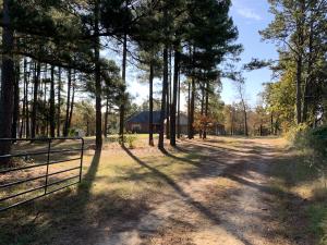 THE BEST OF COUNTRY LIVING is what you'll find in this beautiful home with 3 bedrooms, den, living-dining, country kitchen, family room, 2 baths, 2 car garage and drive-in workshop. All of this is situated for year around enjoyment on approximately 6.3 acres of woods and a pond. The views are spectacular and the opportunities for outdoor enjoyment are unlimited. Call today to see!!