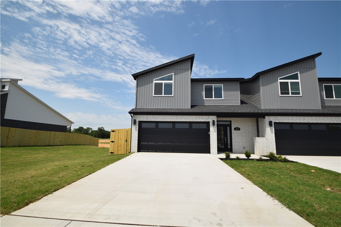 New modern design duplex! Also included brand new side by side stainless refrigerator, washer and dryer. This 3 bed 2 1/2 bath plan has an open living concept with tall ceilings and tons of natural light. Kitchen has granite countertops, stainless appliances, a large pantry, and a gas range. Primary suite is on the main floor and has a beautiful walk-in shower and a large walk-in closet. Two bedrooms upstairs with a full bath and landing area. Wood look tile in main living areas, 2" faux wood blinds, extra storage in the upstairs attic. Property has a private back patio and wood privacy fence. Owner must approve pets and no smoking.