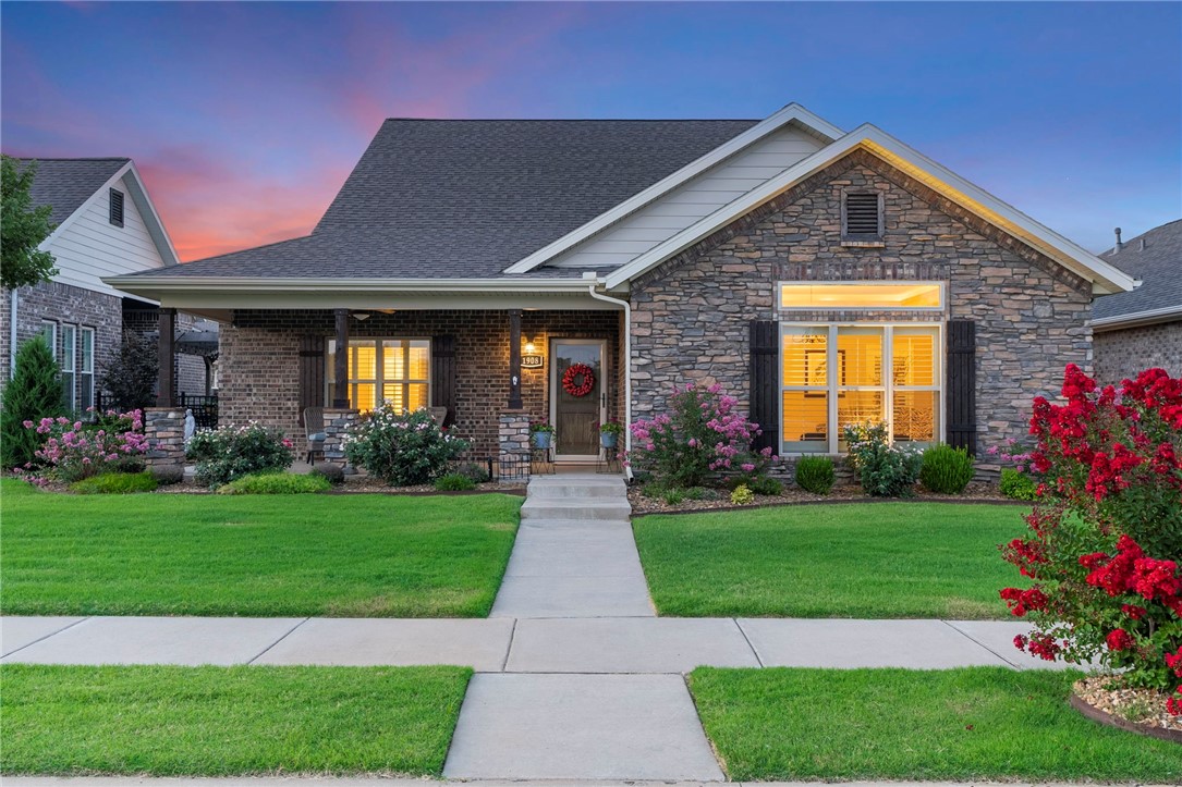 Welcome Home! Located in Elington Village a maintenance free community. Located close to Downtown Bentonville, Wal-Mart HQ and the Bentonville airport. The open floor plan and abundant storage enables this house to "live" much larger than its size. The home features wood floors, crown molding, granite countertops, outdoor living space and a wheelchair accessible shower in the primary bathroom. The quiet neighborhood is situated in a way that limits excess traffic. Enjoy the beautiful sunsets from your front porch or enjoy dining outside on your covered patio that has gas heaters for year round enjoyment. The POA pays for the landscaping and irrigation which creates a neighborhood that looks more like a lush garden oasis. This home is the perfect blend of convenience and elegance.