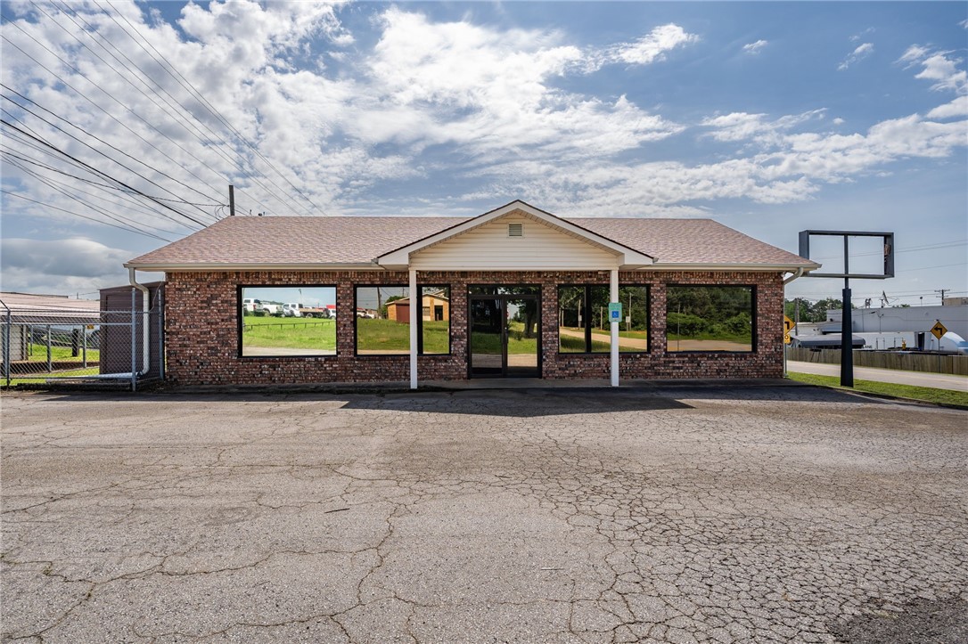 Ready for your new Business Venture? If so, here's the place. Located just off Hwy. 23 and across the street from Walmart with high traffic count, you'll find this neat brick building with a brand new roof and newer flooring and paint throughout. Two restrooms, a kitchenette, carport and asphalt parking area, sum up this perfect place that provides so many business opportunities! Previously used as a water office and Dance/gym studio.