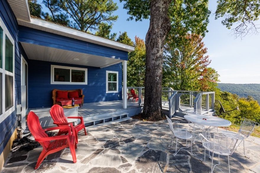 Turnkey mountain retreat just 24 miles from Fayetteville! Fully renovated and beautifully furnished with stunning views, professional landscaping, and a full irrigation system. Move-in ready and ideal as a vacation home, short-term rental, Airbnb, or private mountain getaway. Enjoy the perfect blend of privacy, scenery, and convenience.