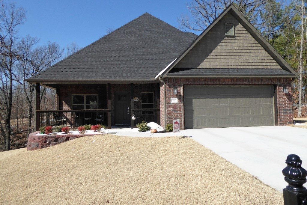 Come see this beautiful 3-bedroom, 2.5-bathrooms with a two-car garage home built in 2021. Master bedroom downstairs, 2nd and 3rd bedroom upstairs. Great location less than a minute to the Branchwood recreation center in the Highlands. Sits on two lots that equal .59 acres that are beautifully landscaped with only two other homes on the street.
Amazing master suite with free standing soaking tub, huge walk-in fully tiled shower (with 2 shower heads and built-in bench), and large walk-in closet with custom shelving and built-in dresser. Custom built wood deck in the back of the house is partially covered with a roof, ceiling fan, and great views of the large wooded double lot. The front of the house boasts a huge covered front porch with plenty of room for more seating.
Kitchen has gray tiled backsplash and gray tile. There is black granite throughout the kitchen and in all the bathrooms. Comes with a propane fireplace and a huge pantry.