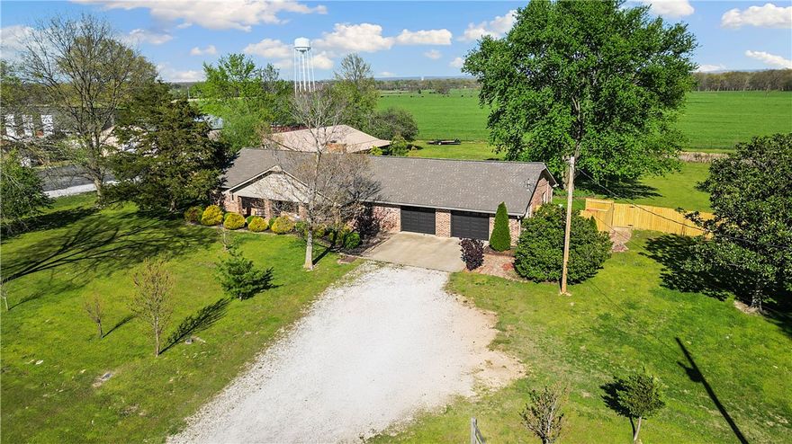Looking for a home with land and a shop?  This charming home on 2.5 acres sits right off Hwy 72, perfectly positioned between Bentonville and Pea Ridge and Bella Vista. With county zoning and nearby commercial development, this property offers exciting flexibility—whether you’re dreaming of a private residence, business venture, or both.
The upstairs of the home is renovated with 2 bedrooms and 2 bathrooms and 2 fireplaces and lovely sunroom.  The home also features a full partially finished basement where you can let your own vision come to life. Out back, you’ll find a spacious 40x60 shop with its own bathroom—ideal for hobbies, storage, or working from-home. And all with Jac’s Ranch cattle pastures as the backdrop.

Located just 10–15 minutes from the Bentonville Square & the award-winning NWA bike network in Bella Vista, this is one of the few remaining areas where you can enjoy acreage while staying close to all the action.

Opportunities like this don’t come along often—schedule your showing today!