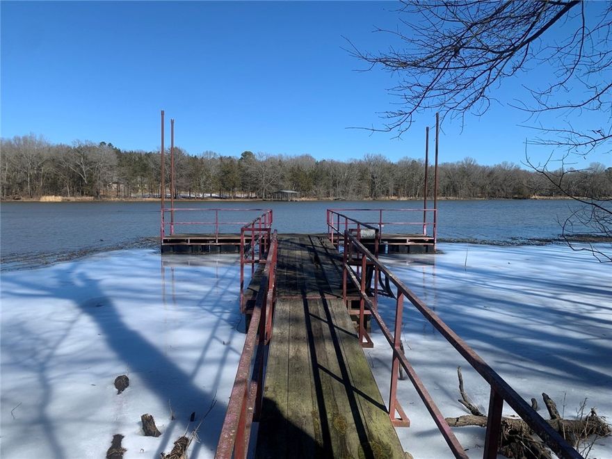 LAKEFRONT PROPERTY.....Located on Dublin Bay, a part of Lake Dardanelle, with a boat dock and nestled between two ridges. Crappie, bass, catfish and brim are plentiful in this beautiful, sheltered bay. Two bedroom house with a double car garage and a 24 X 30 metal workshop. On a dead end road with a nice garden spot and plenty of room to grill or fry your catch of the day. Quick and easy access to Lake Dardanelle, the Arkansas River, Thompson Bay and shoal Bay. Call today for your appointment to see this rare and unique property.  To be sold "As Is, Where Is, With All Faults Basis".