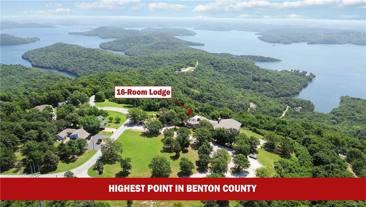 Stellar opportunity to operate a restaurant or event center with breathtaking views from the highest
point in Benton County, AR. At over 1,800' elevation, Whitney Mountain Lodge offers unparalleled
scenery and versatility. The property includes a commercial kitchen equipped with a vent hood, grills,
ovens, dishwasher, sinks, prep stations, and some accessories to run a restaurant. Your guests will be
greeted with a spacious reception area, which then flows into elegant dining/banquet rooms featuring
large windows showcasing panoramic lake views, and flow seamlessly into a spacious bar area. Two
large decks provide additional scenic seating outdoors with views of the lake. For extended hospitality,
the lodge includes 16 furnished hotel rooms generating immediate cash flow. Options range from rooms
with private balconies and hot tubs to standard lake-view rooms. Each room is competitively prices from
$129-$229/night. A separate hotel check-in office and vending area complete this ready-to-operate
facility.