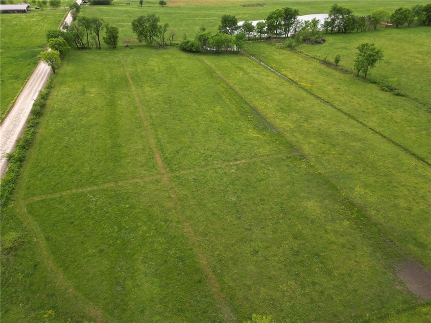 Beautiful 10-acre tract offering open, gently rolling terrain—perfect for building your dream home! This property features easy access to rural water, and a layout that makes construction a breeze. Conveniently located just off pavement, you’ll enjoy peaceful country living without sacrificing accessibility. Whether you're looking for a homesite, hobby farm, or weekend retreat, this versatile piece of land is ready for your vision.