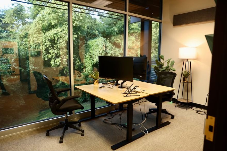 Outstanding open space office in natural setting with balcony overlooking puppy creek. Open space, office, and conference rooms.