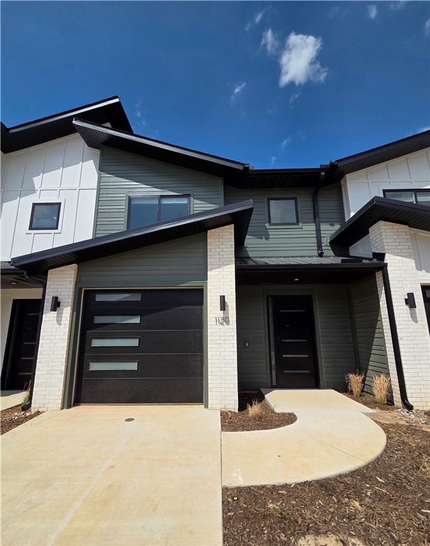 Welcome to Parkside of Lowell — where contemporary design meets vibrant community living. These thoughtfully crafted luxury townhomes boast spacious open floor plans, finishes include quartz countertops, stainless steel appliances, & elegant oak-style vinyl flooring throughout. With energy-efficient, all-electric systems, comfort meets cost savings year-round. This is the Lucy plan-with "Medium (Wood Tone)" interior finishes. Perfectly positioned along the Razorback Greenway & surrounding the coming soon - Kathleen Johnson Park — future home of the exciting NWA Space and Science Center — Parkside offers unmatched access to outdoor living & convenience. Residents enjoy resort-style
amenities, including a clubhouse, gym, pool, pickleball, basketball and more. Call to schedule your tour
today! Not all photos are of exact unit