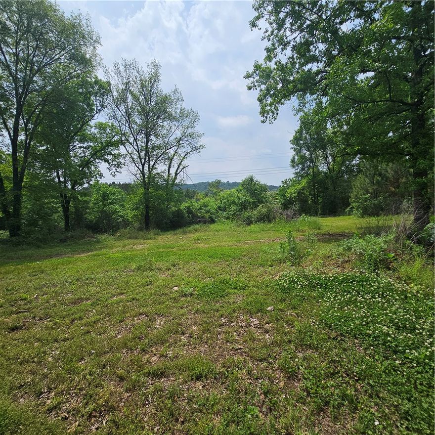 Hard-to-Find 5 Acres with Utilities Already On Site—Creek Included! Beautiful 5-acre property in Lamar, AR ready for your new home. Utilities already on site, septic in place, making it an excellent building location with less prep work required. Enjoy the natural beauty of a scenic creek running through the property, offering a peaceful setting for your dream home or weekend retreat. Located in a quiet rural area with convenient access to nearby towns. Bring your plans and make this property your own!
A peaceful creek runs through the property, adding natural charm and creating a relaxing setting surrounded by the beauty of the Arkansas countryside. Whether you’re looking for space to build, room to roam, or a quiet place to enjoy nature, this property offers the flexibility to bring your vision to life.