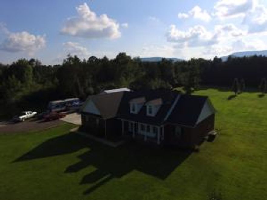 Country Charmer on 3.34 acres, 3BR, 2BA complete with outdoor kitchen and fireplace. The living room offers a custom rock wood burning fireplace with vaulted ceiling. There is an open kitchen and dining area. Kitchen has built in oven with separate stovetop, all kitchen appliances to convey. Master bedroom overs door out to patio. Custom barn door into master bath, that offers separate whirlpool tub and shower and large walk in closet. Split floor plan with 2 more bedrooms and bath on other end. Watch the deer as you enjoy the outdoor kitchen and fireplace. 30 x 30 fully insulated shop with 10 ft roll up door. Radiant floor heating (just needs hot water heater and to be hooked up) that will keep you nice and toasty in the winter. Projector & screen in shop to enjoy all the sporting events.
