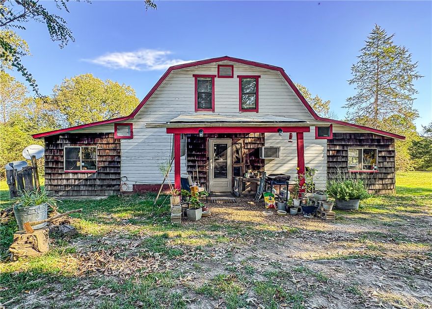 Charming Country home on 8 acres in the Ozarks! Escape to the peace and beauty of the Ozark mountains with this 2-bedroom, 2 bath farmhouse offering 1,856 square feet of comfortable living space. Nestled on 8 private acres, this property combines rustic charm with modern convenience-perfect for those seeking a quiet country lifestyle. Inside, you’ll find a warm, open layout featuring a
spacious living area, country kitchen, and plenty of natural light throughout. Enjoy cozy evenings on the porch while taking in the surrounding hills and wildlife. Amenities include a private well and
septic, a spacious shop building with 220 power and plenty of room for gardening, livestock, or recreation. Located in the heart of the Ozarks, you’ll appreciate the serene setting with easy access to
nearby lakes, rivers, and small-town amenities. Whether you’re looking for a full-time residence, weekend retreat, or hobby farm, this property is ready to welcome you home. Come enjoy country living at its finest!